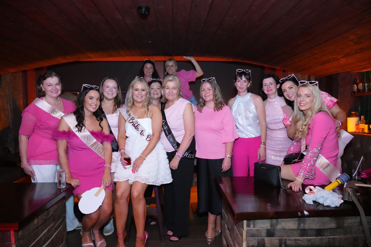 A hen party in pink sashes